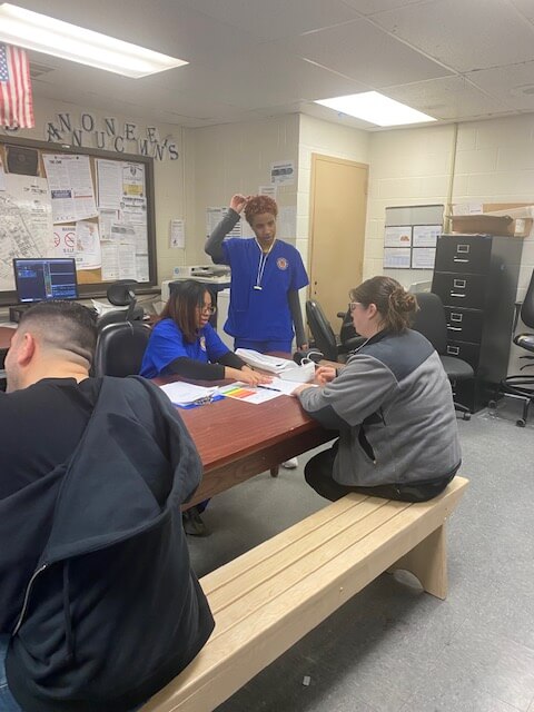 Officers at a screening table